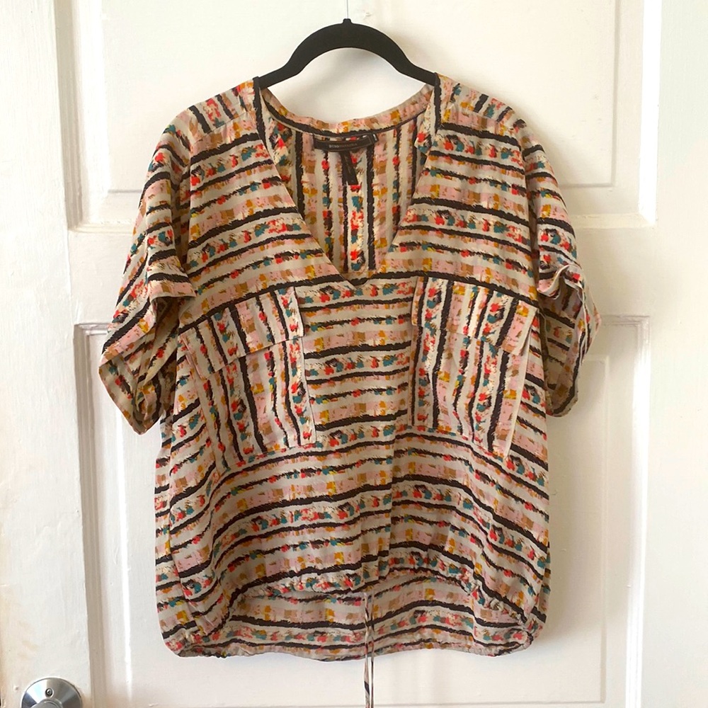 BCBG multi-colored 100% silk blouse with front pockets.